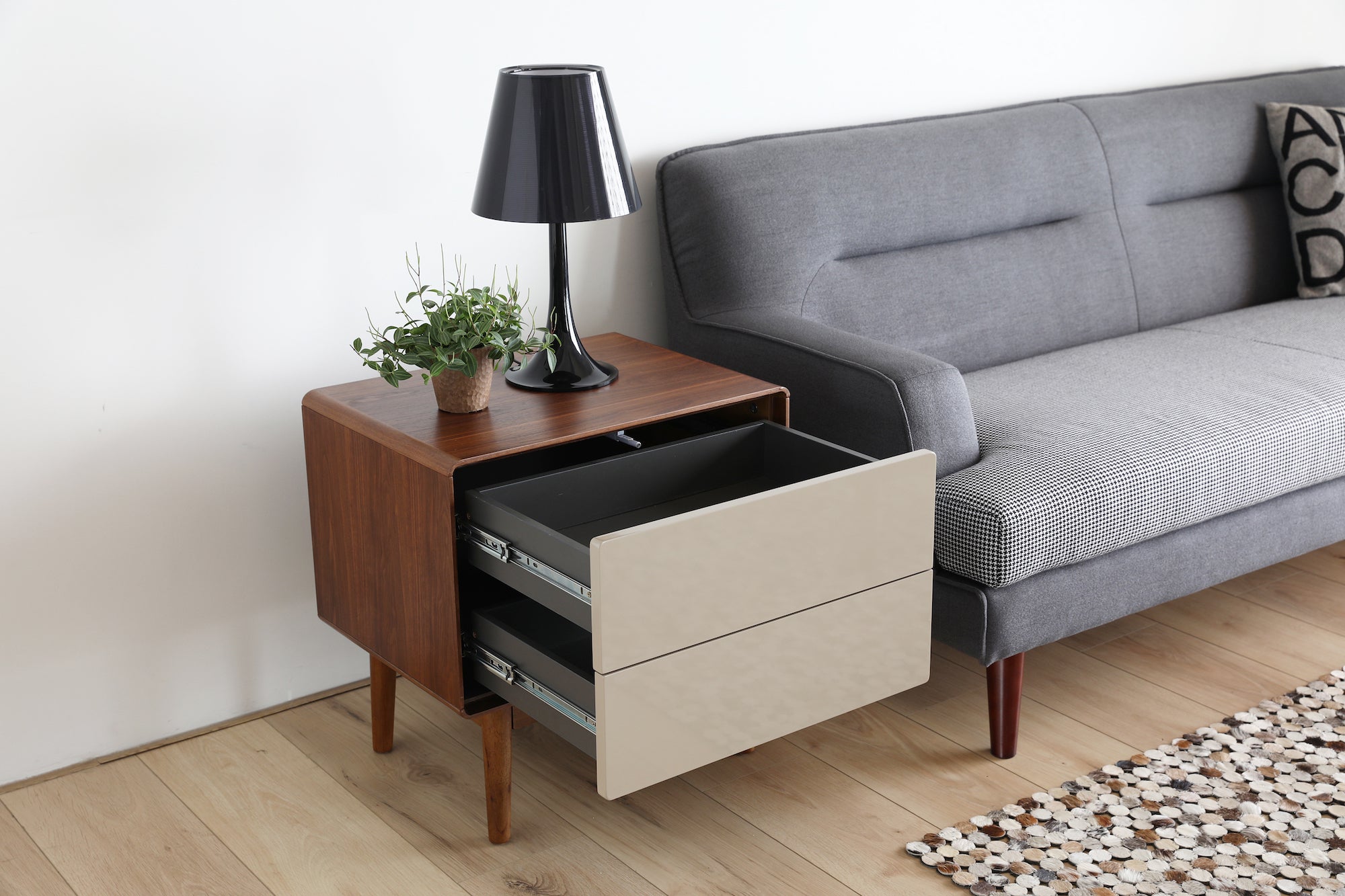 Bedside Table and blue sofa on wooden floor