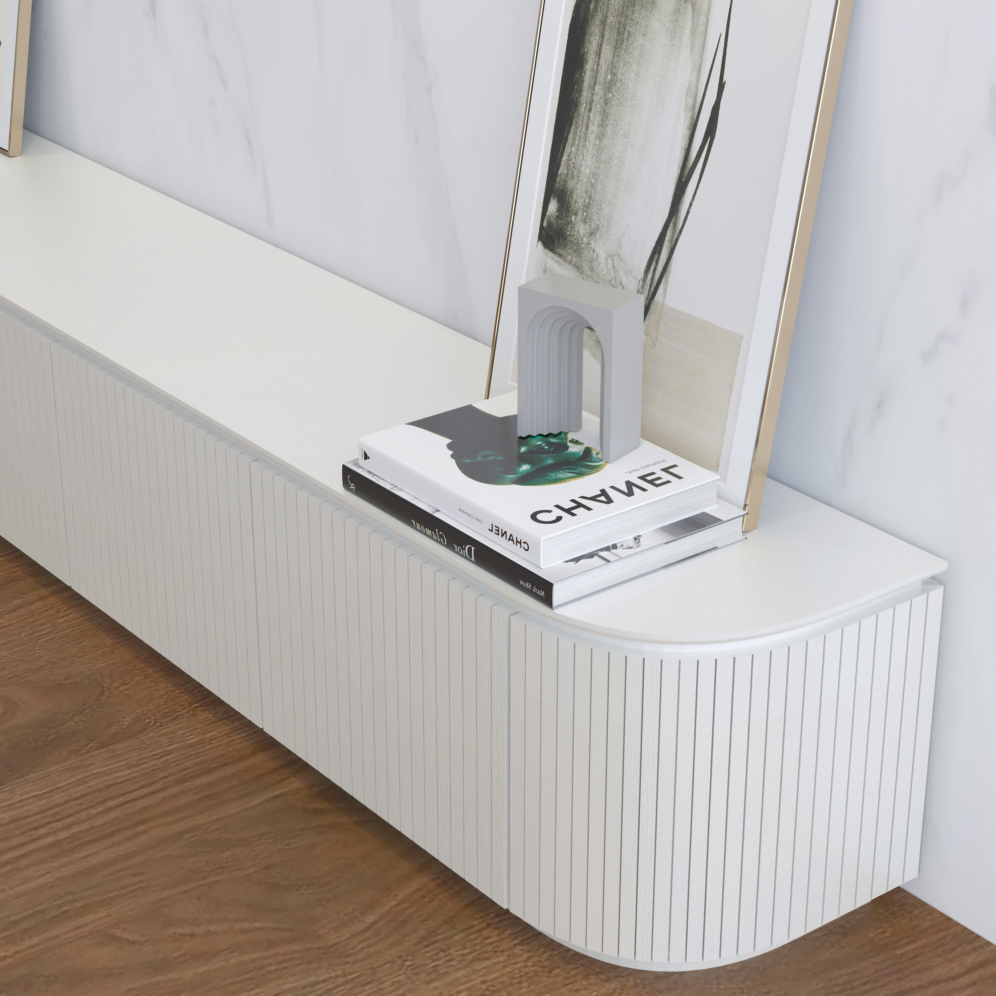 Charles TV Unit in matte white finish with curved edges and slatted door detailing