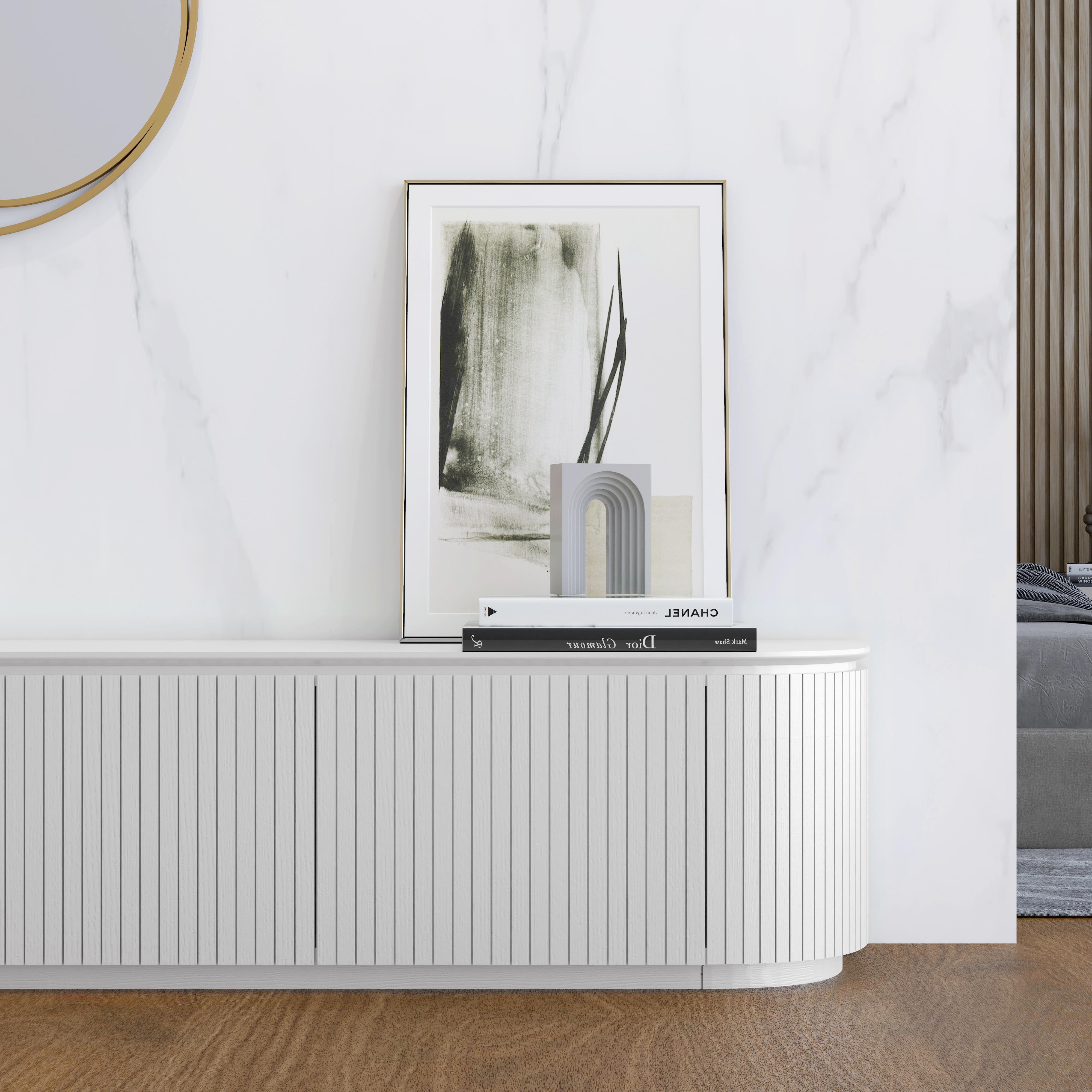 Charles TV Unit in matte white finish with curved edges and slatted door detailing