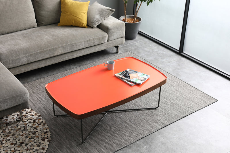 Red coffee table in grey lounge